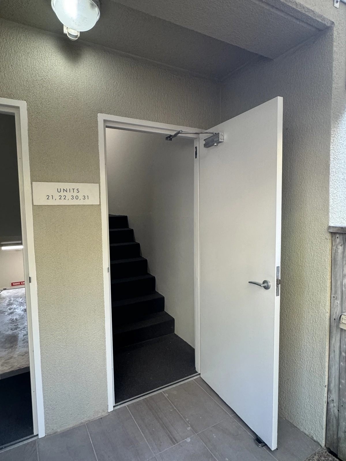 Open access door leading to an Avoca Palms stairwell
